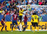 Jul 26, 2017; Santa Clara, CA, USA; United States goalkeeper Tim Howard (center) blocks a shot on goal by Jamaica defender Damion Lowe in the first half during the CONCACAF Gold Cup final at Levi's Stadium. Mandatory Credit: Mark J. Rebilas-USA TODAY Sports