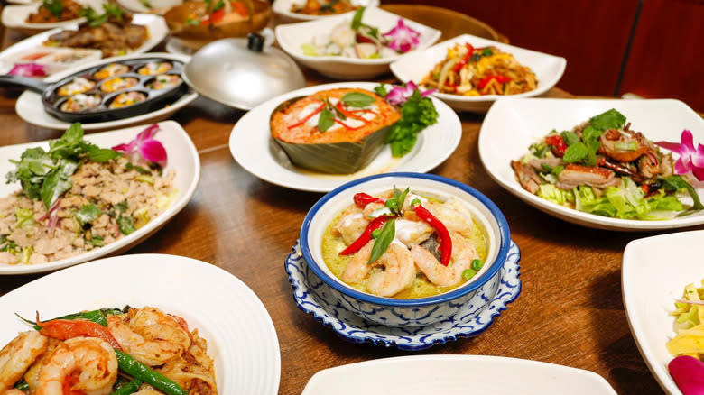 table with multitude of thai dishes