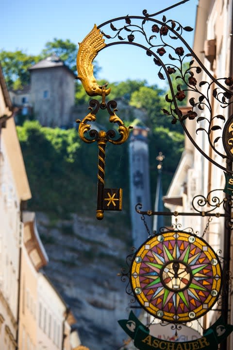 A traditional sign on Getreidegasse - Credit: GETTY