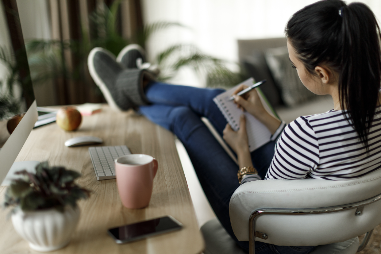 Woman writing in notebook