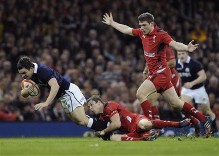 Wales' Liam Williams tackles Scotland's Dougie Fife during their Six Nations Championship rugby union match at the Millennium Stadium, Cardiff, Wales, March 15, 2014. REUTERS/Rebecca Naden
