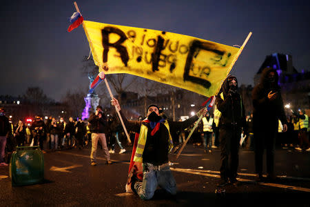 Protesters wearing yellow vests gather at the Place de la Republique for a so-called "yellow night" by the "yellow vests" movement in Paris, France January 26, 2019. REUTERS/Benoit Tessier