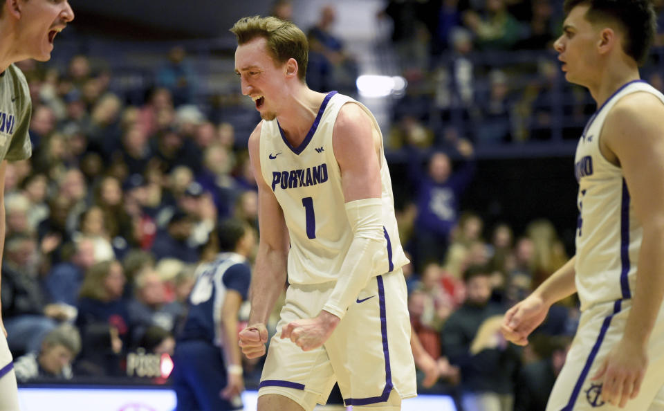 Portland forward Moses Wood reacts after hitting a shot during the first half of an NCAA college basketball game against the Gonzaga in Portland, Ore., Saturday, Jan. 28, 2023. (AP Photo/Steve Dykes)