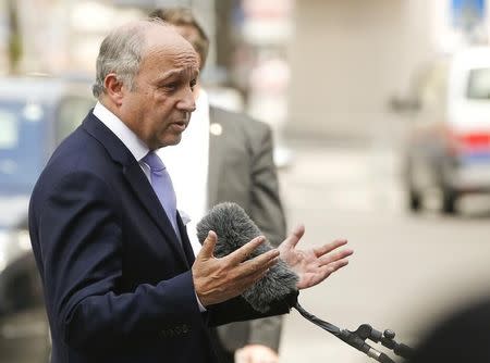 French Foreign Minister Laurent Fabius talks to journalists in front of Palais Coburg, the venue for nuclear talks in Vienna, Austria, July 12, 2015. REUTERS/Leonhard Foeger