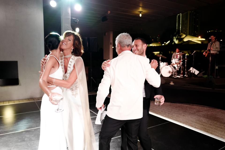 This was right after my dad’s hilarious speech. My mom wore all white and a cape/veil to part of the wedding. I gave her a hard time, but it really looked beautiful.