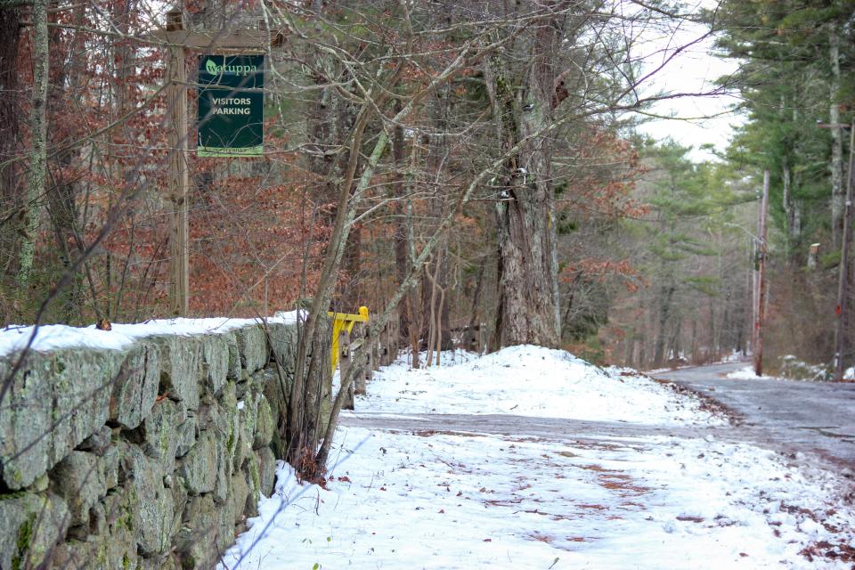 The landscape is covered with snow near a parking lot in the Southeastern Massachusetts Bioreserve, on Blossom Road in Fall River.