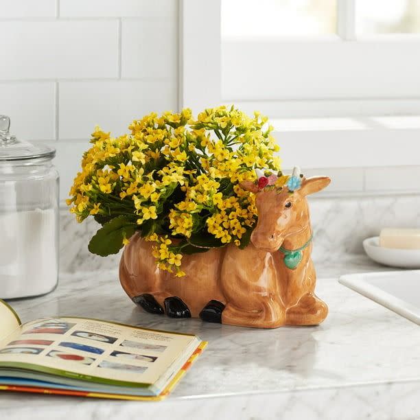<p><a href="https://go.redirectingat.com?id=74968X1596630&url=https%3A%2F%2Fwww.walmart.com%2Fip%2FThe-Pioneer-Woman-Brown-Cow-Planter-Stoneware-6-in-opening%2F828458452&sref=https%3A%2F%2Fwww.thepioneerwoman.com%2Fhome-lifestyle%2Fdecorating-ideas%2Fg44076346%2Fcow-decor%2F" rel="nofollow noopener" target="_blank" data-ylk="slk:Shop Now;elm:context_link;itc:0;sec:content-canvas" class="link ">Shop Now</a></p><p>The Pioneer Woman Brown Cow Planter</p><p>$16.47</p><p>walmart.com</p><span class="copyright">Walmart</span>