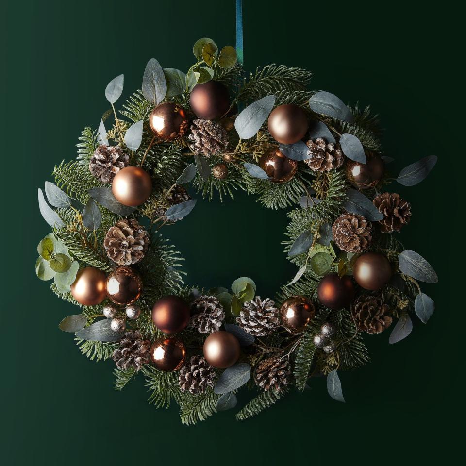 <p>A Christmas wreath isn't just for the front door. You could place it in your hallway or use it as a table centrepiece. </p><p>'Copper will continue to be a big colour trend this Christmas thanks to its warming qualities and autumnal vibe,' say Waitrose.</p>