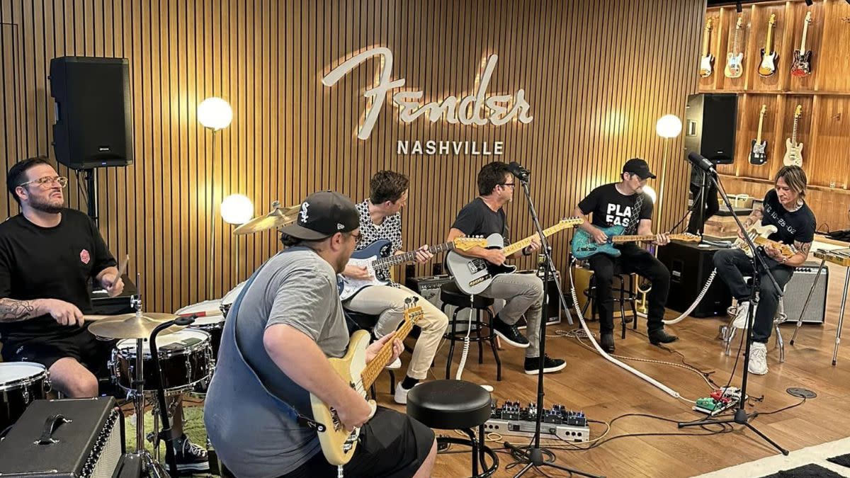  A number of guitarists jam at Fender's new Nashville HQ. 