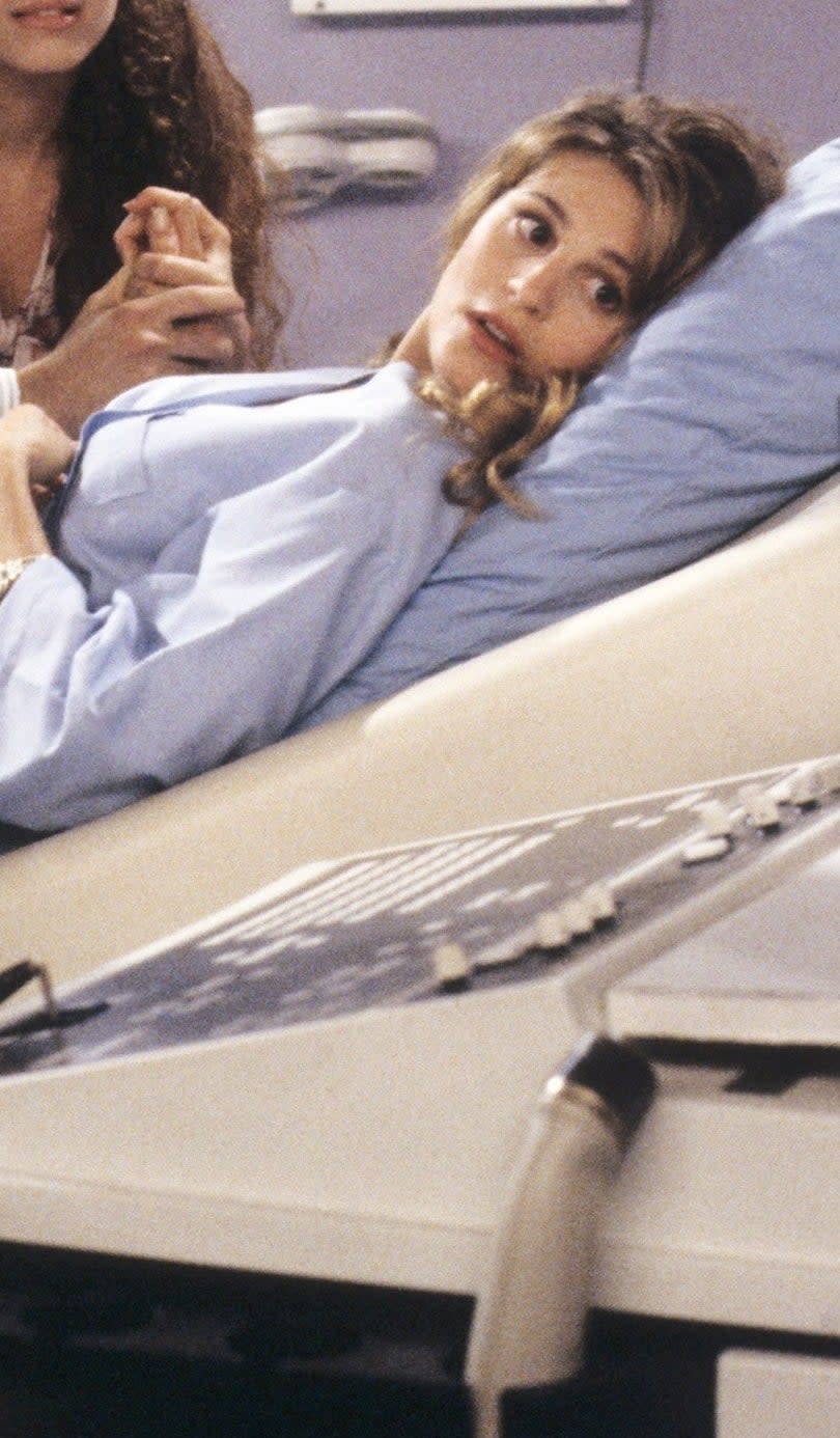 closeup of her in character on a hospital bed