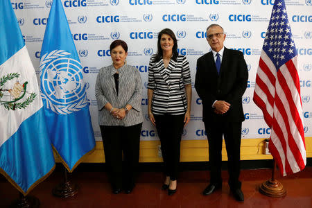 U.S. Ambassador to the United Nations Nikki Haley poses for a picture with Attorney General Thelma Aldana and Commissioner Ivan Velasquez at the offices of the International Commission Against Impunity in Guatemala (CICIG), in Guatemala City, Guatemala February 28, 2018. REUTERS/Luis Echeverria