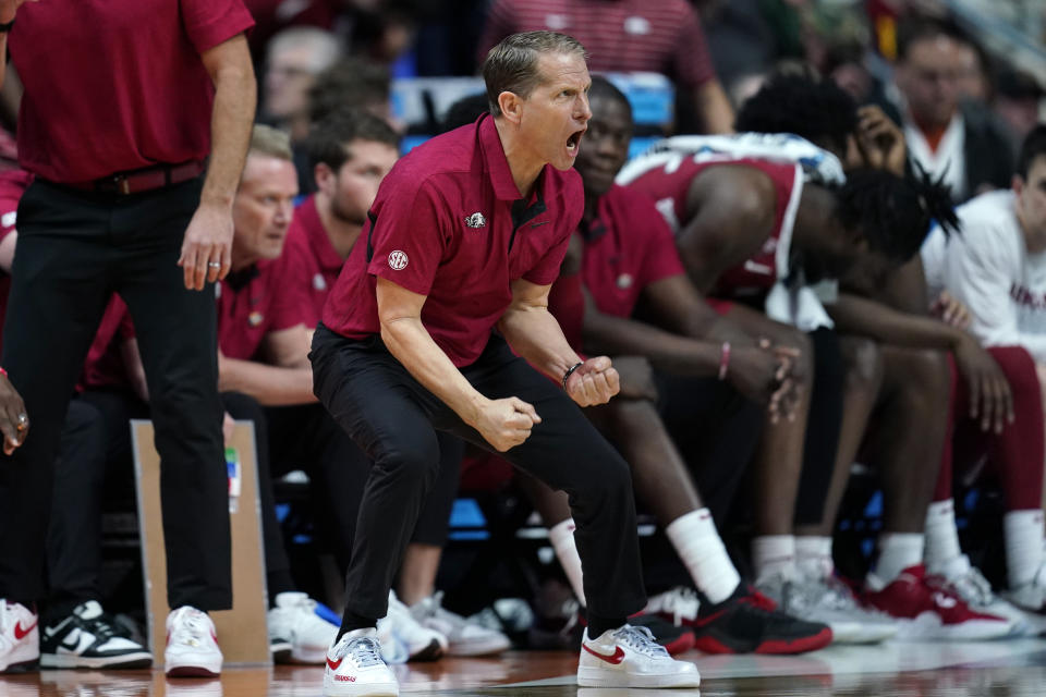 FILE - Arkansas head coach Eric Musselman reacts on the bench in the second half of a second-round college basketball game against Kansas in the NCAA Tournament, Saturday, March 18, 2023, in Des Moines, Iowa. Musselman has a support staff of 14 people beyond himself and three assistants with the goal of being “at the forefront of analytics.” That includes a director of internal operations, a director of scouting, a recruiting coordinator, an assistant director of recruiting and scouting, and seven graduate assistants. (AP Photo/Charlie Neibergall, File)