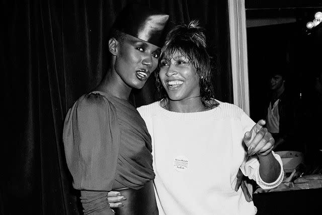 <p>Gary Gershoff/Getty</p> Grace Jones and Tina Turner in 1981