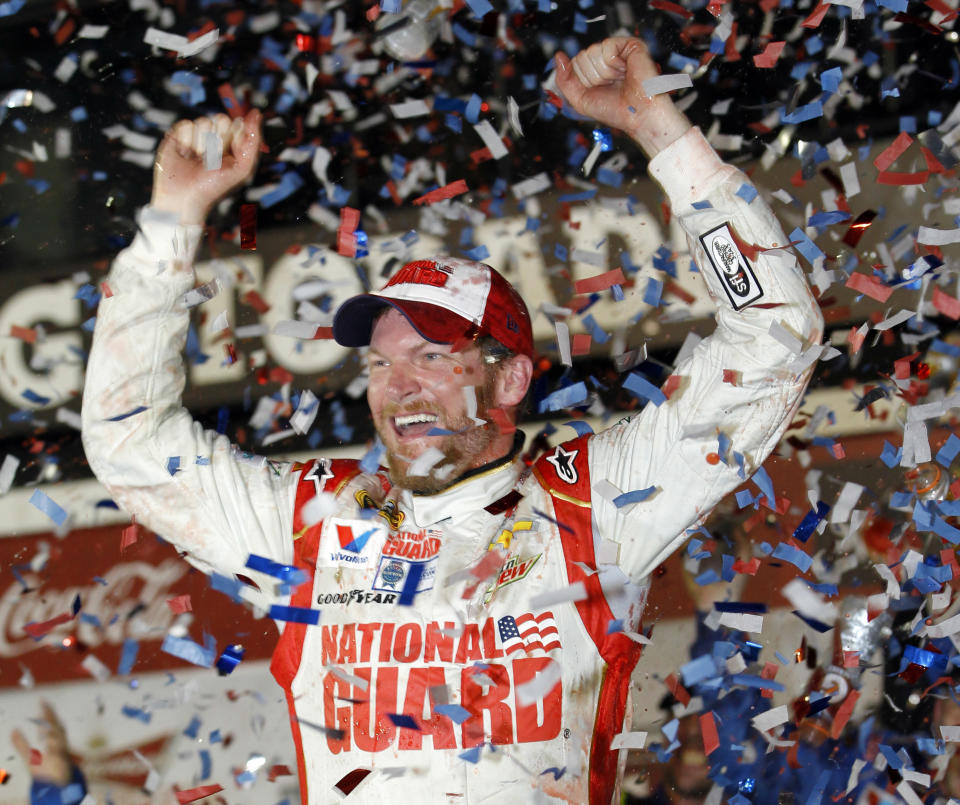 FILE - Dale Earnhardt Jr. celebrates in Victory Lane after winning the NASCAR Daytona 500 Sprint Cup series auto race at Daytona International Speedway in Daytona Beach, Fla., Feb. 23, 2014. Hendrick Motorsports will celebrate its 40th anniversary in NASCAR this season, a kickoff that begins at the Daytona 500, a race Rick Hendrick hasn’t won since 2014 with Dale Earnhardt Jr. (AP Photo/Terry Renna, File)