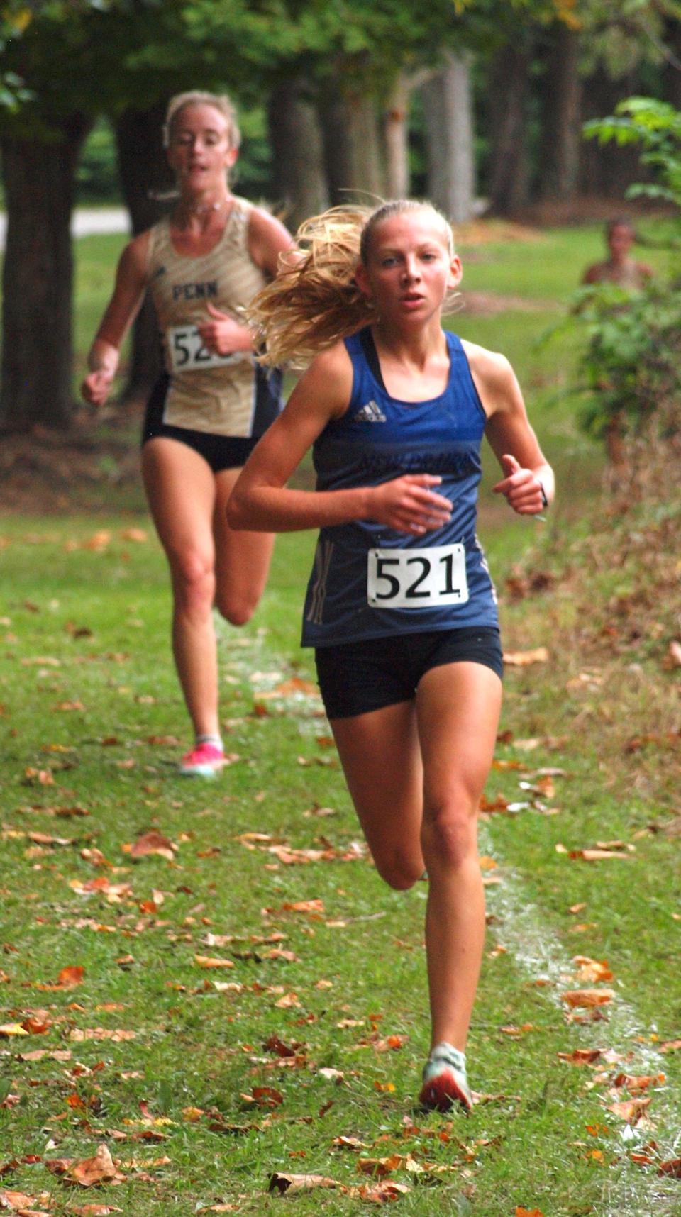 New Prairie's Lilly Zelasko, shown at last year's Northern Indiana Conference meet, won the NIC title again Saturday, this time breaking the 18-minute barrier with a 17:46.69 time.