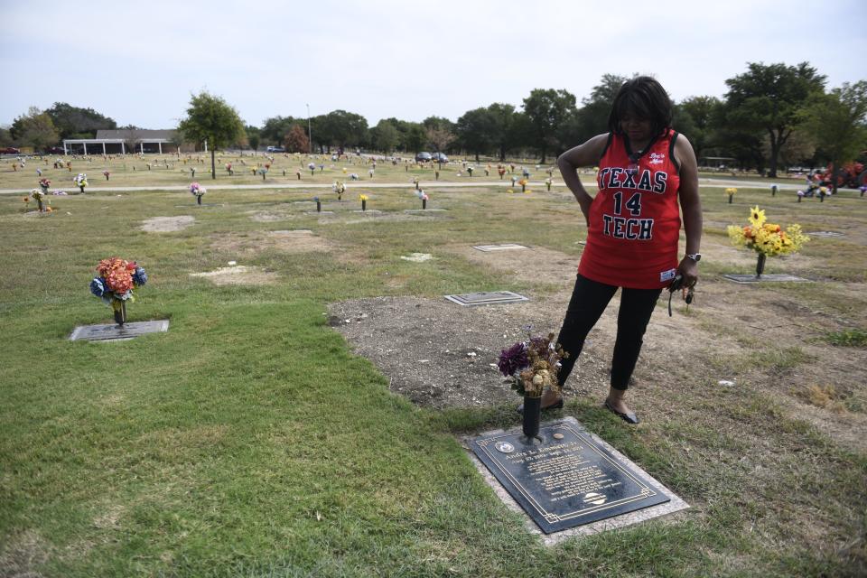 Regina Oliver visits her son's grave, Thursday, Sept. 21, 2023, in Dallas. "Andre made a great mark within his dash," Oliver says.