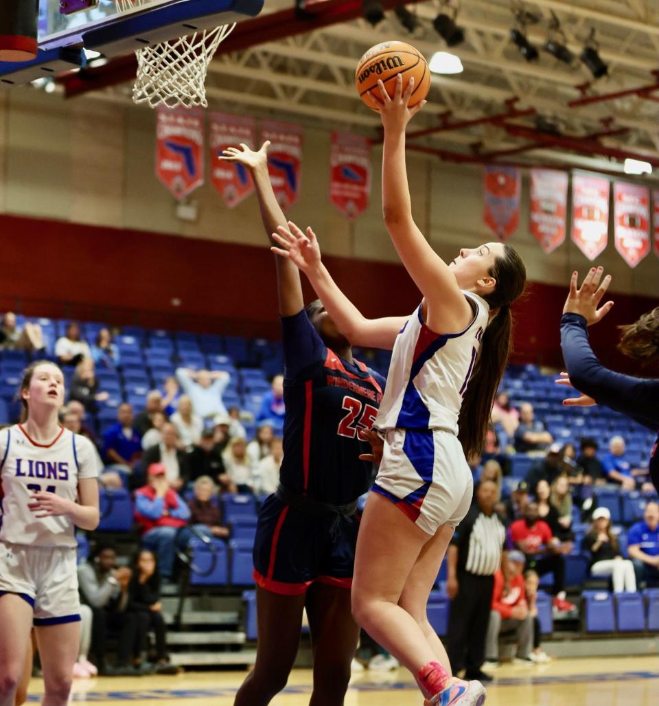 King's Academy girls basketball junior Sophia Kateris (11) shoots a layup against Windermere Prep in a playoff game on Monday, Feb. 19, 2024 in West Palm Beach.