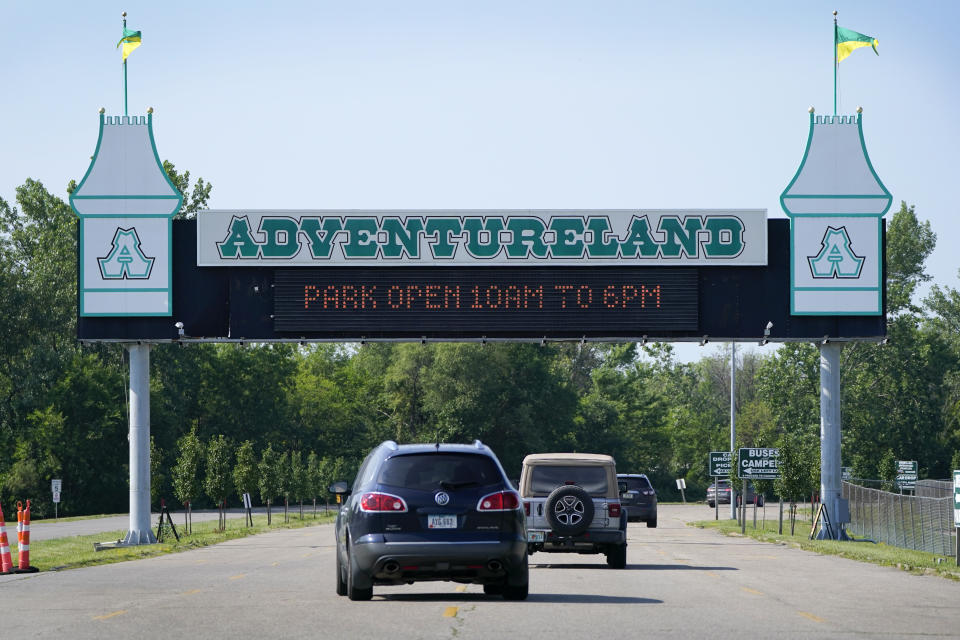 FILE - Visitors arrive at the Adventureland Park amusement park, July 6, 2021, in Altoona, Iowa. On Friday, Feb. 3, 2023, the managers of the Iowa amusement park said a ride that an 11-year-old boy died on in 2021 will never reopen. Adventureland's general manager announced the decision in a letter posted on the park's website. (AP Photo/Charlie Neibergall, File)