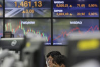 A currency trader watches computer monitors at the foreign exchange dealing room in Seoul, South Korea, Thursday, Aug. 22, 2019. Asian stock markets are mixed Thursday following Wall Street’s rebound as investors looked ahead to a speech by the U.S. Federal Reserve chairman for clues about possible interest rate cuts. (AP Photo/Lee Jin-man)
