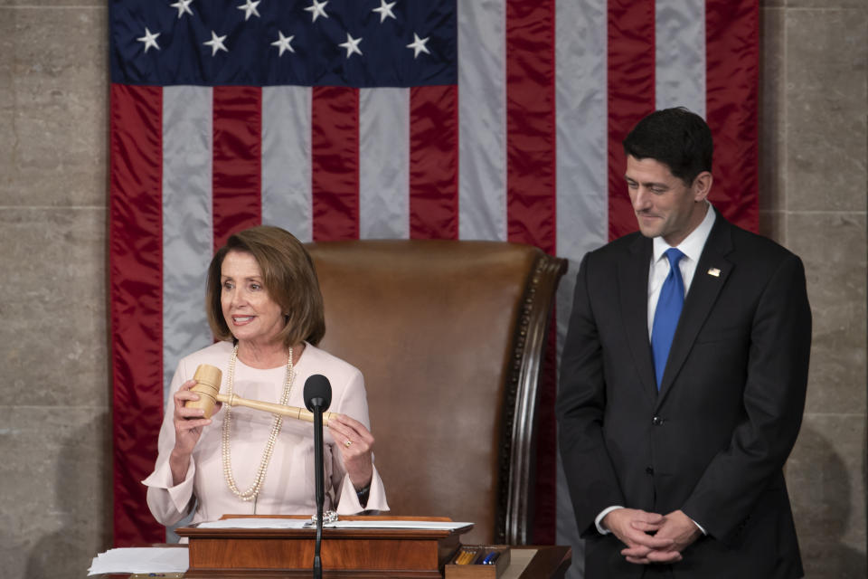 In this file photo from Tuesday, Jan. 3, 2017, House Democratic Leader Nancy Pelosi of California, left, joins Speaker of the House Paul Ryan, R-Wis., at the start of the 115th Congress, at the Capitol in Washington. The Republicans will relinquish the majority to House Democrats under leadership of Nancy Pelosi as speaker on Thursday, Jan. 3, 2019, beginning a new era of divided government. (AP Photo/J. Scott Applewhite, file)