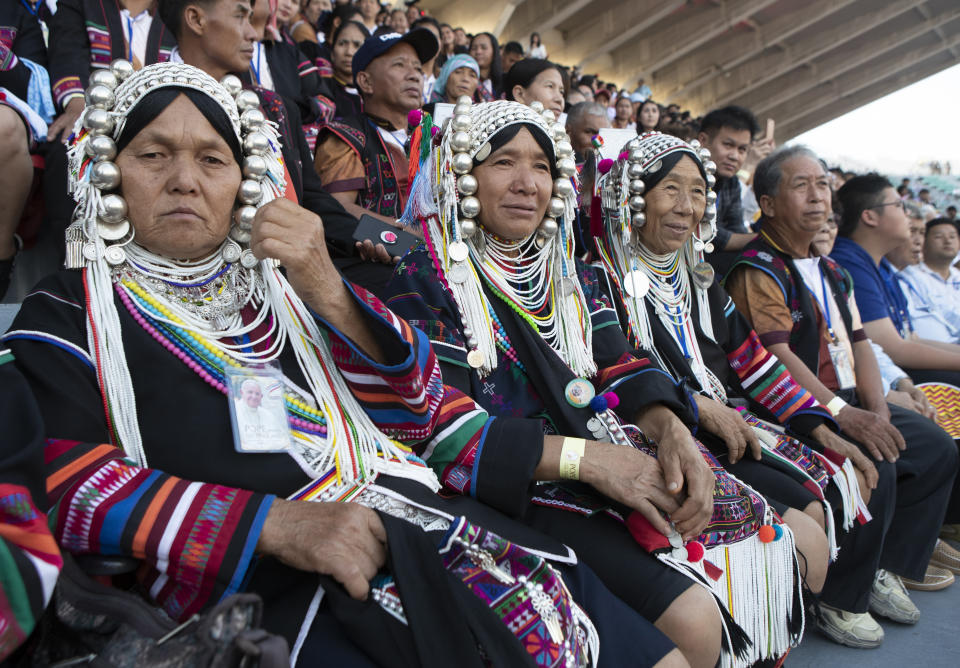 Catholics from tribal areas wait for Pope Francis before a Holy Mass at National Stadium in Bangkok, Thailand, Thursday, Nov. 21, 2019. (AP Photo/Sakchai Lalit)