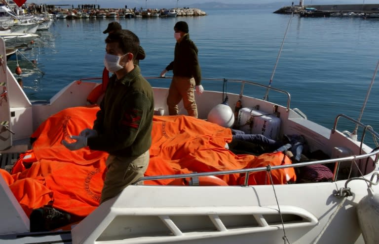 The bodies of drowned migrants lie covered on the deck of a rescue boat on February 8, 2016