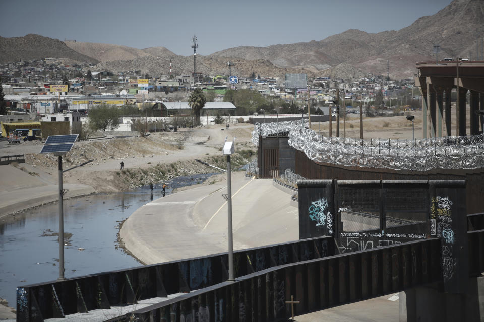 People cross the Rio Grande from Ciudad Juarez, Mexico into El Paso, Texas, Tuesday, March 23, 2021. Mexico announced that U.S. advisers on border and immigration issues will meet with Mexican officials on Tuesday to discuss migration and development in Central America, as a surge of migrants has hit the U.S. southern border. (AP Photo/Christian Chavez)