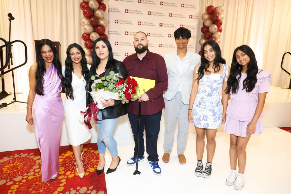 Miguel Rodriguez, a former Desert Valley Hospital COVID-19 patient is flanked by the Dr. Prem Reddy Family. Rodriguez spoke during the Reddy Family Foundation scholarship award ceremony on Thursday, June 15, 2023.