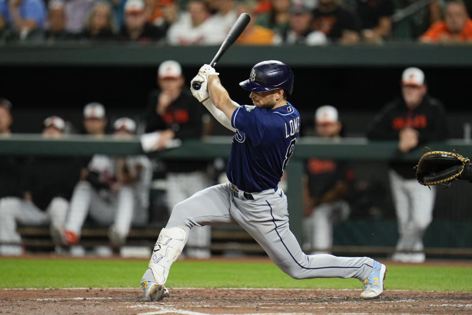 Tampa Bay Rays' Brandon Lowe follows through on a swing as he hits an RBI single to score Luke Raley in the third inning of a baseball game against the Baltimore Orioles, Thursday, Sept. 14, 2023, in Baltimore. (AP Photo/Julio Cortez)