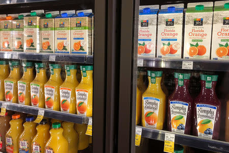 Coca-Cola Co's Simply Orange is displayed next to Whole Foods' private label 365 Everyday Value orange juice in a Whole Foods Market store in Venice, California, U.S., March 17, 2018. REUTERS/Lisa Baertlein