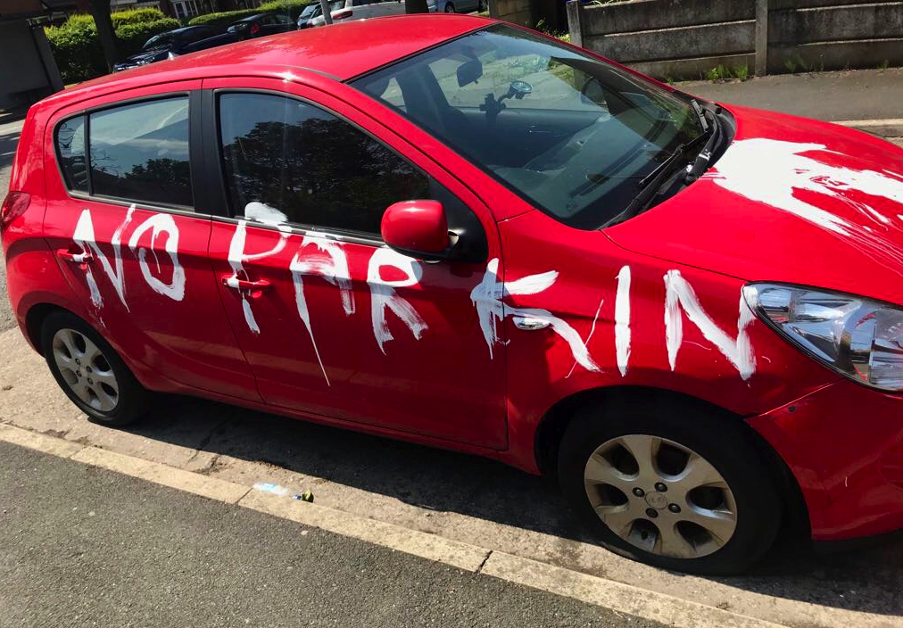 The cars were vandalised on a residential street in Manchester (GMP)