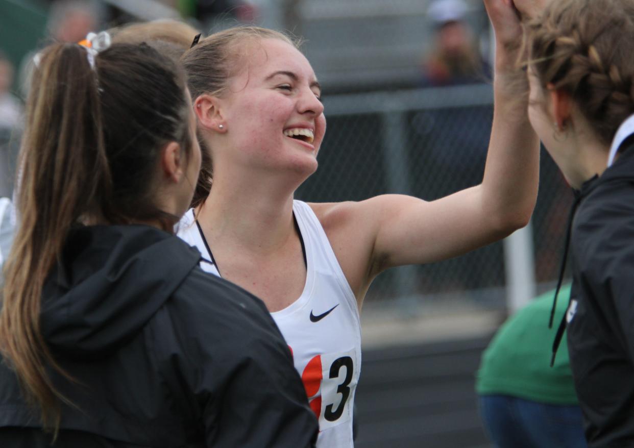 Brighton's Nikki Carothers is congratulated after winning the 3,200-meter run during the KLAA track and field championships Saturday, May 11, 2024 at Howell High School.
