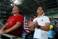 2016 Rio Olympics - Taekwondo - Preliminary - Men's -80kg Preliminary Round - Carioca Arena 3 - Rio de Janeiro, Brazil - 19/08/2016. Mark Lopez cheers on his brother Steven Lopez (USA) of USA (not pictured). REUTERS/Issei Kato