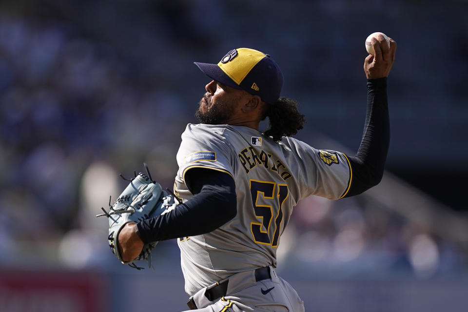 Milwaukee Brewers starting pitcher Freddy Peralta throws to the plate during the second inning of a baseball game against the Los Angeles Dodgers Saturday, July 6, 2024, in Los Angeles. (AP Photo/Mark J. Terrill)