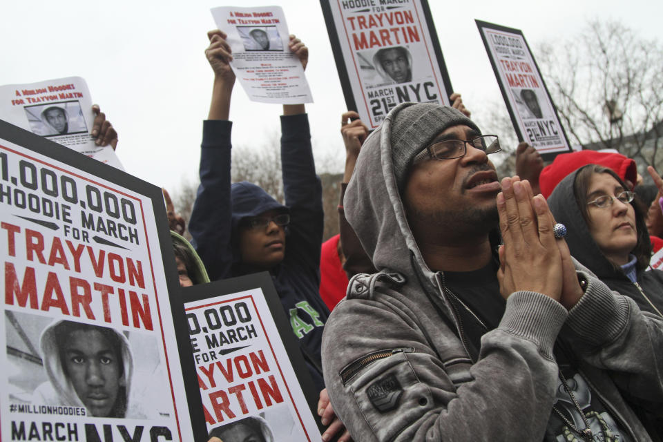 FILE - Demonstrators pray during the Million Hoodie March for Trayvon Martin in Union Square, March 21, 2012, in New York. The Black Lives Matter movement hits a milestone on Thursday, July 13, 2023, marking 10 years since its 2013 founding in response to the acquittal of the man who fatally shot Martin. Gunned down in a Florida gated community where his father lived in 2012, Martin was one of the earliest symbols of a movement that now wields influence in politics, law enforcement and broader conversations about racial progress. (AP Photo/Mary Altaffer, File)