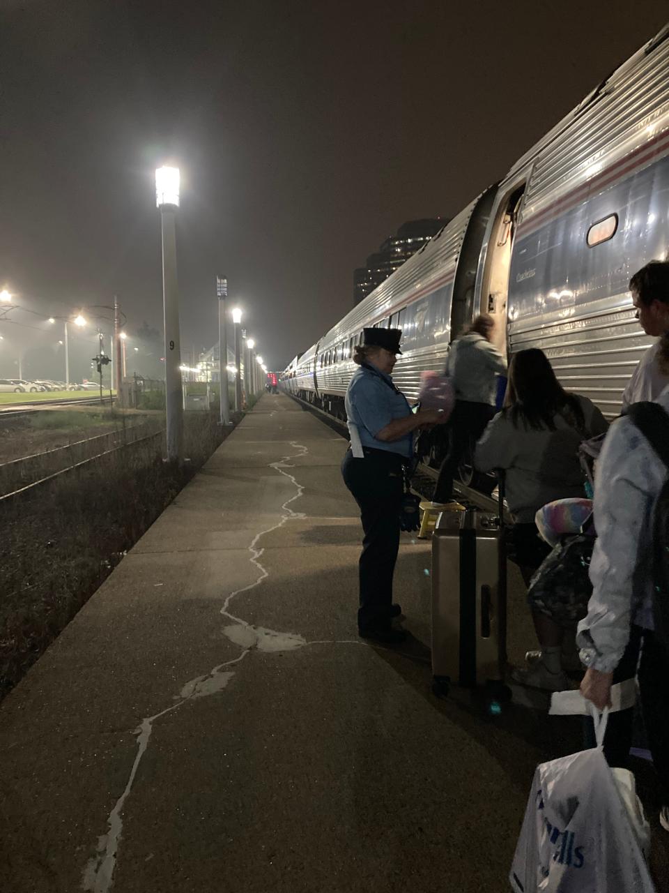 A train attendant checks people's tickets and assigns them seats on Amtrak's Lake Shore Limited train at 4:30 a.m. June 28, the beginning of Tawney's cross-country adventure by train.