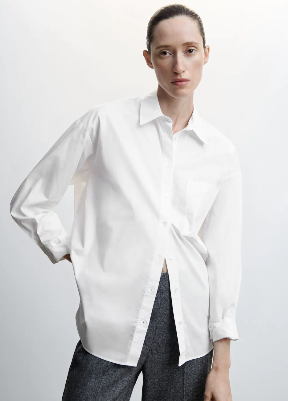 model wearing grey pants and Oversize Cotton Shirt in off white (photo via Mango)