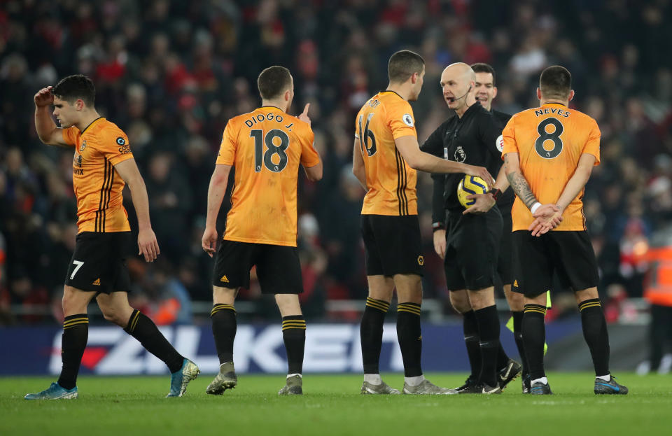 Soccer Football - Premier League - Liverpool v Wolverhampton Wanderers - Anfield, Liverpool, Britain - December 29, 2019   Wolverhampton Wanderers' Conor Coady appeals to referee Anthony Taylor   Action Images via Reuters/Carl Recine    EDITORIAL USE ONLY. No use with unauthorized audio, video, data, fixture lists, club/league logos or "live" services. Online in-match use limited to 75 images, no video emulation. No use in betting, games or single club/league/player publications.  Please contact your account representative for further details.