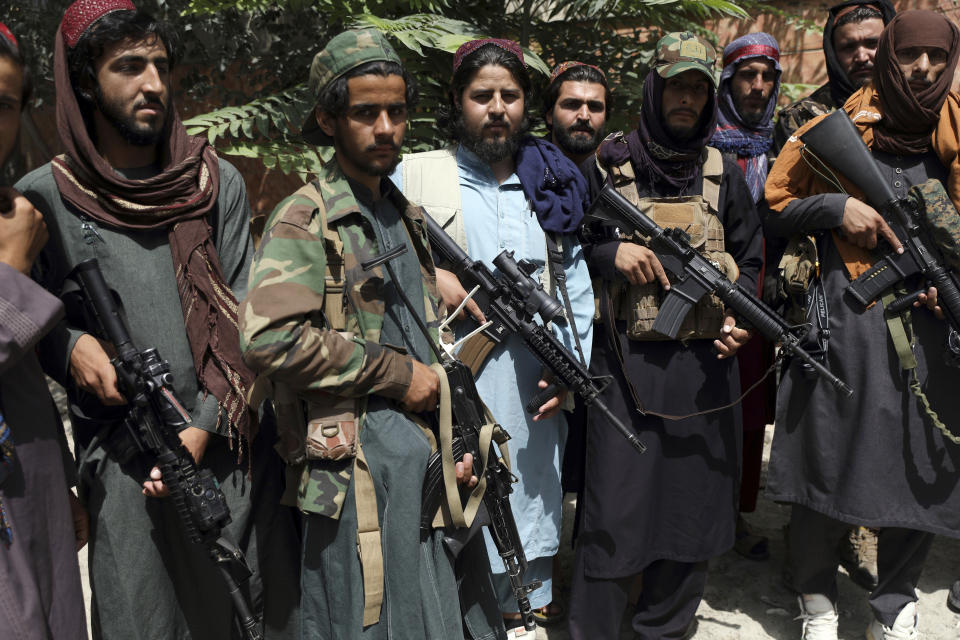 Taliban fighters pose for photograph in Wazir Akbar Khan in the city of Kabul, Afghanistan, Wednesday, Aug. 18, 2021. The Taliban declared an "amnesty" across Afghanistan and urged women to join their government Tuesday, seeking to convince a wary population that they have changed a day after deadly chaos gripped the main airport as desperate crowds tried to flee the country. (AP Photo/Rahmat Gul)