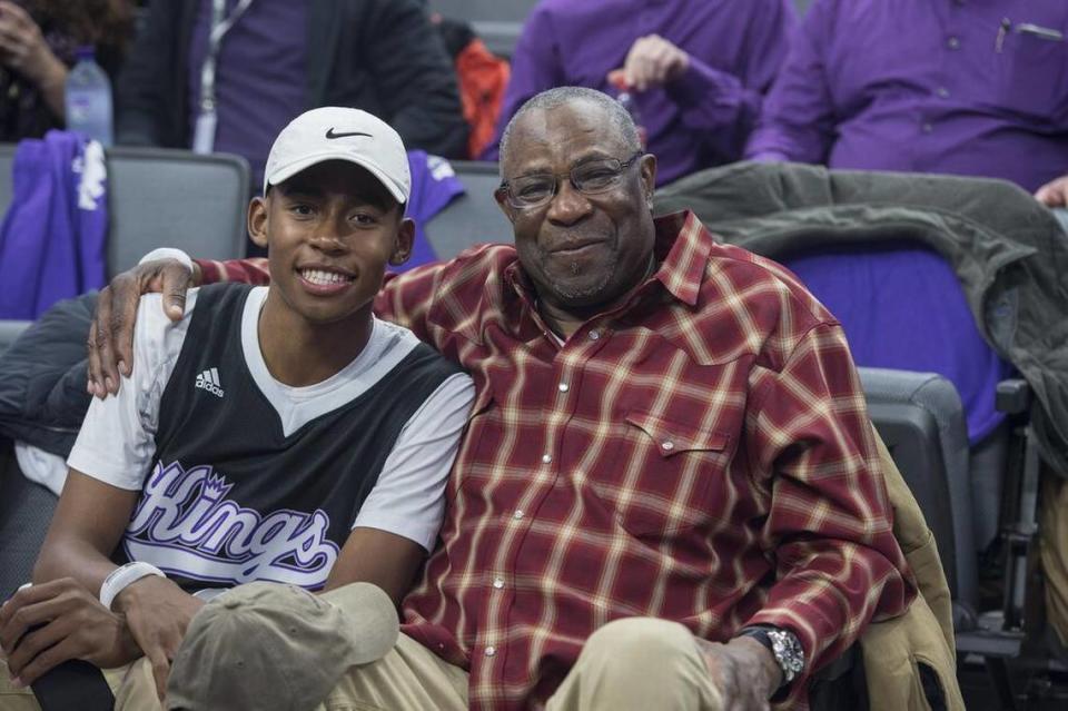 Sacramento baseball legend and then-Washington Nationals Manager Dusty Baker and his son Darren sit in the stands before the Sacramento Kings home opener at the Golden 1 Center in 2016.