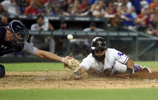 Texas Rangers second baseman Rougned Odor (12) steals home ahead of the tag of Detroit Tigers catcher John Hicks. (AP)