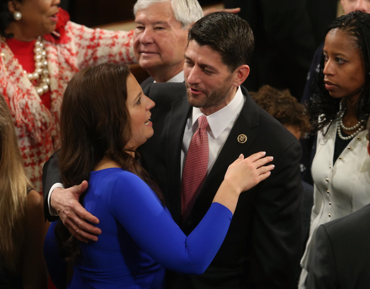 U.S. Rep. Elise Stefanik (R-NY)(L) gets a hug from U.S. Rep. Paul Ryan (R-WI) before the start of the first session of the 114th Congress in the House Chambers January 6, 2015 in Washington, DC. (Mark Wilson/Getty Images)