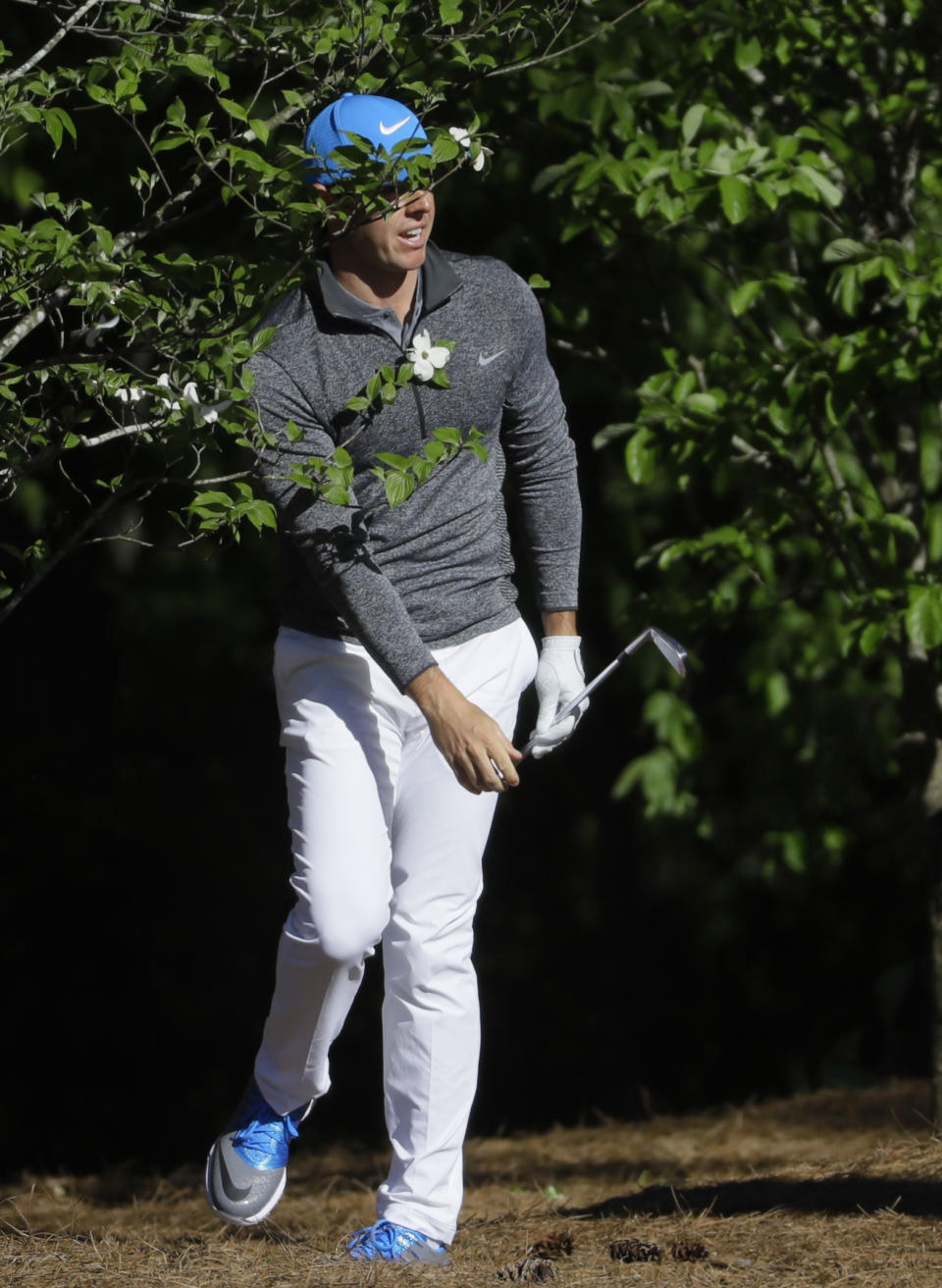 Rory McIlroy, of Northern Ireland, looks at his shot out of the pine straw on the 11th hole during the third round of the Masters golf tournament Saturday, April 9, 2016, in Augusta, Ga. (AP Photo/Chris Carlson)