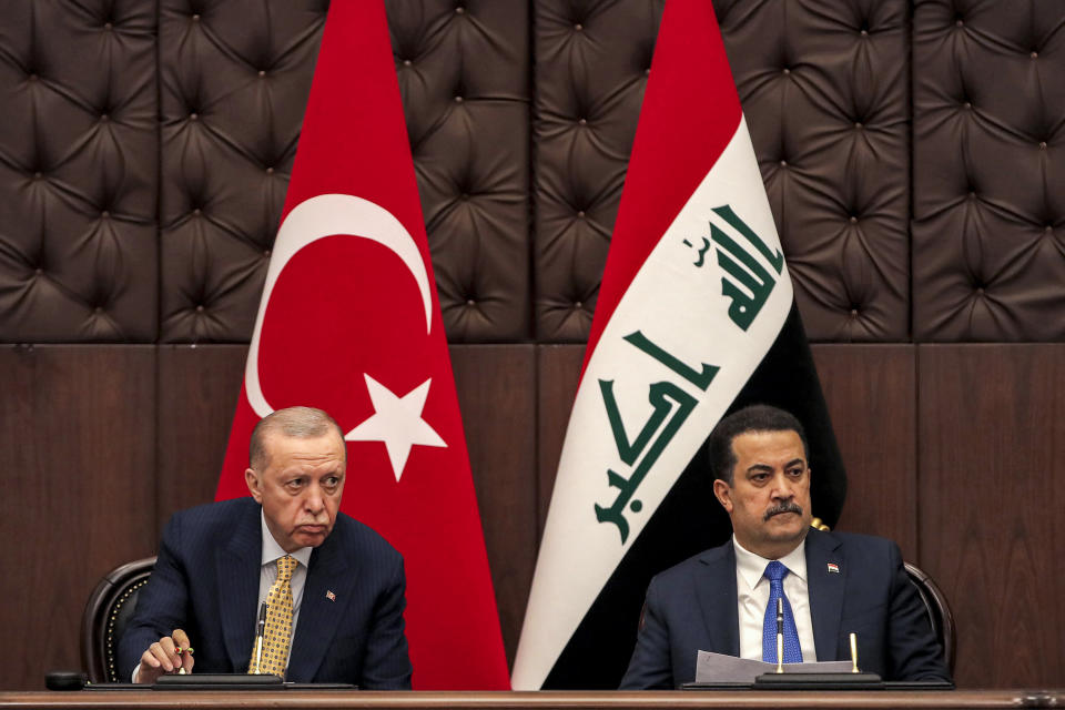 Iraq's Prime Minister Mohammed Shia al-Sudani, right, and Turkey's President Recep Tayyip Erdogan attend a meeting to sign mutual agreements in Baghdad, Monday, April 22, 2024. (AHMAD AL-RUBAYE / Pool Photo via AP)