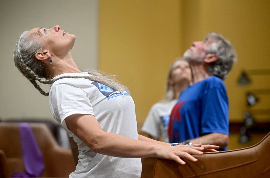 Danielle DuVall leads a set of stretching and balance exercises during an Elevated Function class on Tuesday, July 9, 2024 at Calvary Church.