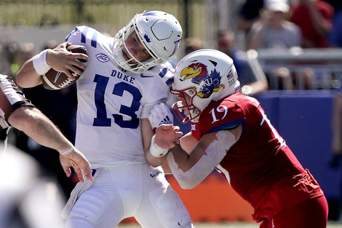 Kansas linebacker Gavin Potter (19) pushes Duke quarterback Riley Leonard (13) out of bounds during the second half of an NCAA college football game Saturday, Sept. 24, 2022, in Lawrence, Kan. Kansas won 35-27.