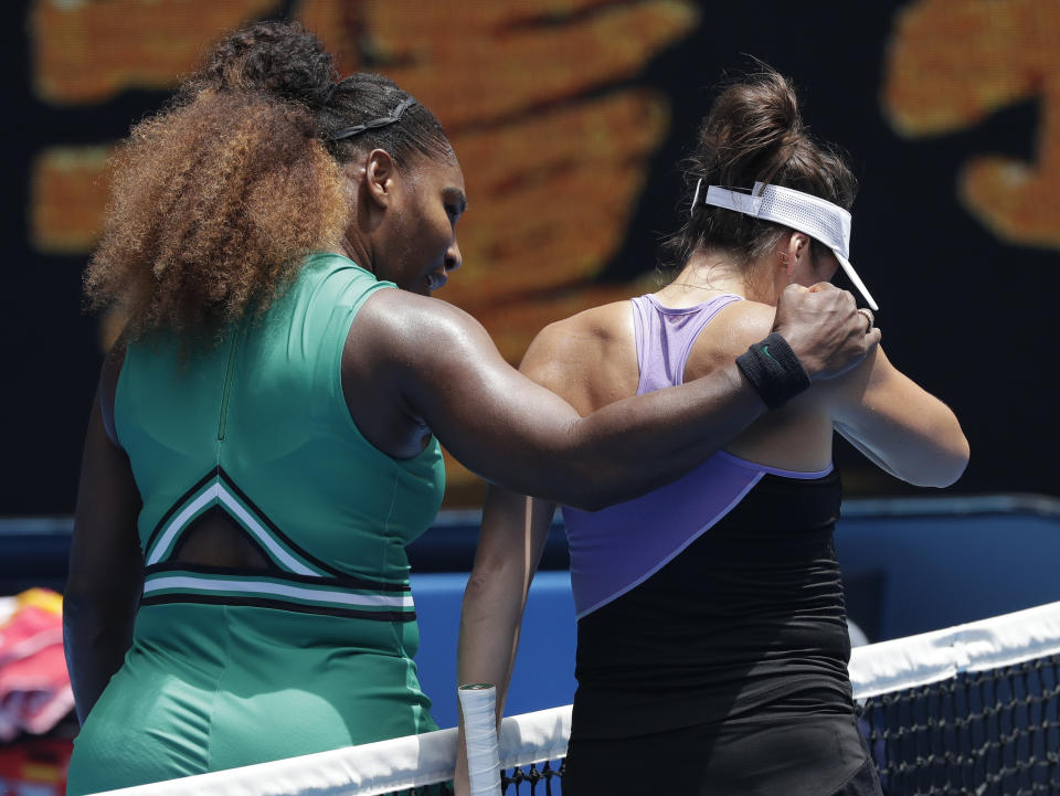 United States' Serena Williams, left, embraces Germany's Tatjana Maria at the net following their first round match at the Australian Open tennis championships in Melbourne, Australia, Tuesday, Jan. 15, 2019. (AP Photo/Kin Cheung)