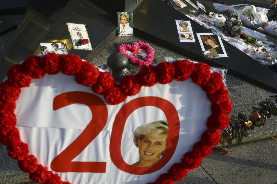 <p>Photographs and flowers are placed by people in memory of the late Princess Diana above the Pont de l’Alma tunnel in Paris, Aug. 31, 2017. (Photo: Thibault Camus/AP) </p>