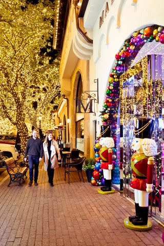 <p>Gabriela Herman</p> Highland Park Village, a historic shopping destination, shines with elaborate decorations and window displays.