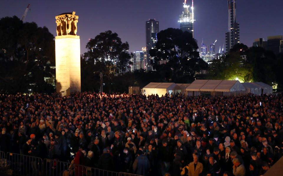 Crowds gather during the Anzac Day dawn service in front of the perpetual flame at the Shrine of Remembrance in Melbourne. Source: AAP 